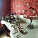 Marble-top side table with period service set.